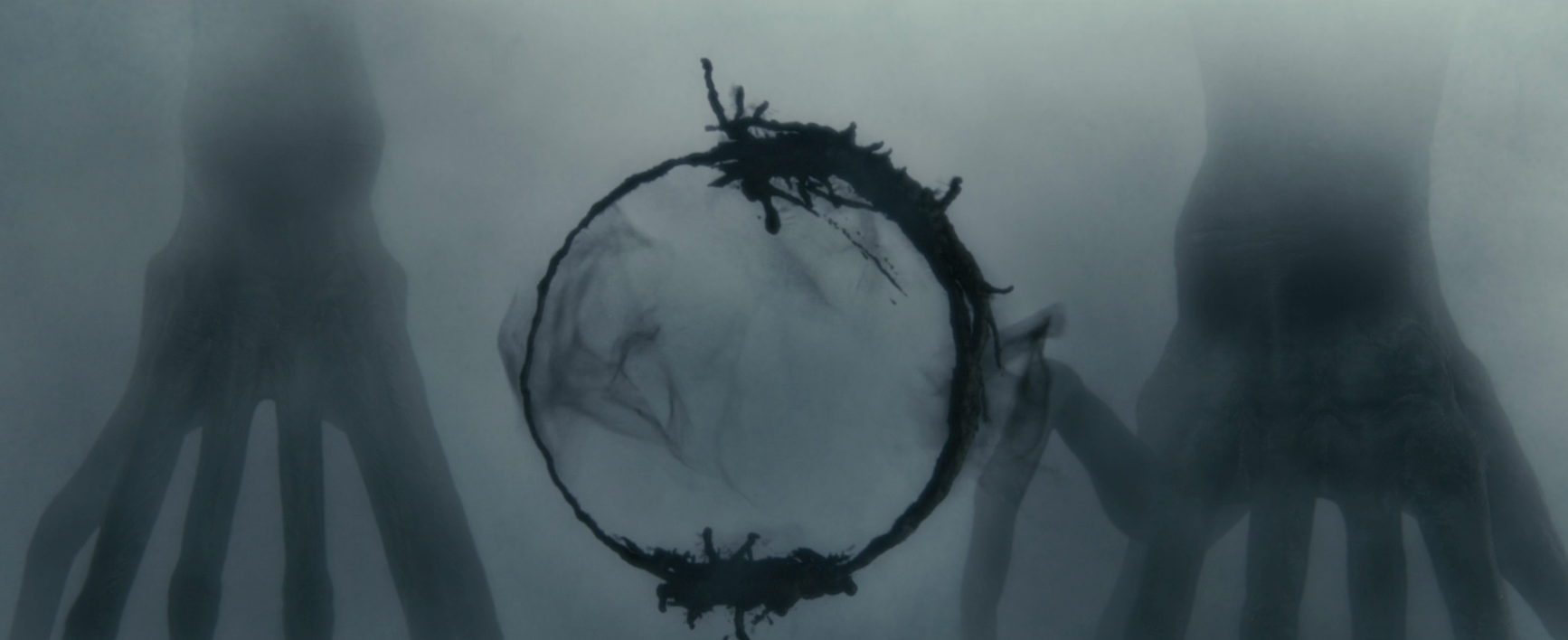 A couple of eptapods writing a circle of ink